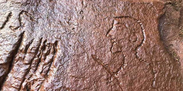 The caricature of a Roman officer cut into the ancient quarry near Hadrian's Wall.