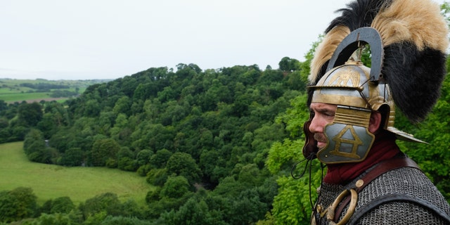 File photo - A reenactor dressed as a Roman soldier stands guard looking out over the countryside of Cumbria from the Birdoswald Roman Fort as the lives of Roman Legionnaires are re-enacted during the Hadrian's Wall Live event on Sept. 3, 2016 in Carlisle, England. (Photo by Ian Forsyth/Getty Images)