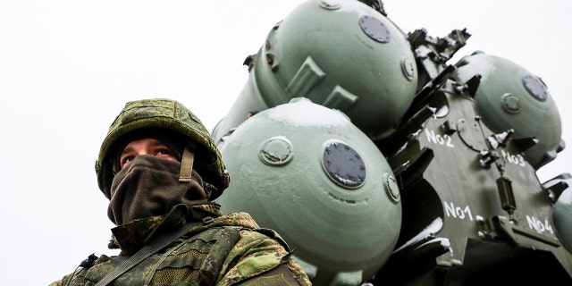 A service man or an S-400 triumph missile system crew on standby as an anti-aircraft military unit of the Russian Air Force and the Russi in Southern Military District enters combat duty near the Crimean town of Dzhankoy.