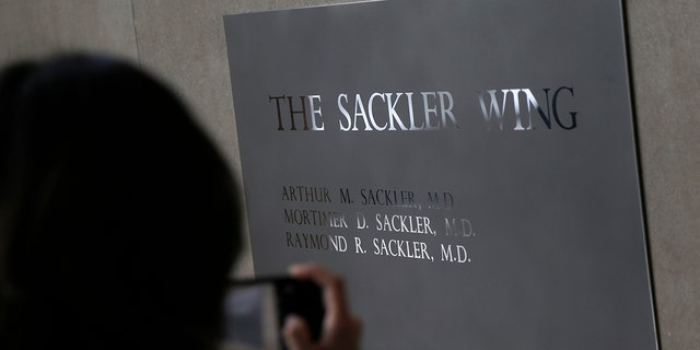 A sign bearing certain names of the Sackler family is on display at the Metropolitan Museum of Art in New York.