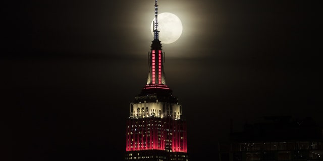 The Empire State building is seen as a super moon rises in New York, United States on February 19, 2019