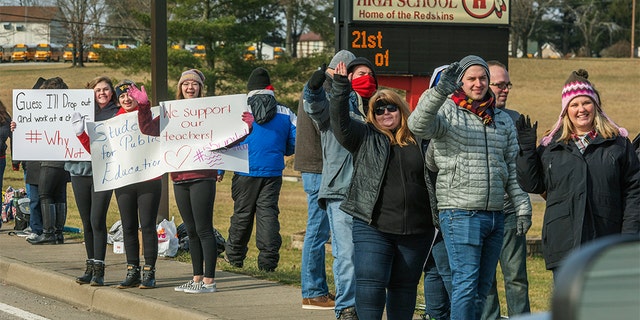 Teachers, students and supporters protested outside of Hurricane High School in Putnam County, West Virginia on Tuesday, Feb. 19, 2019.