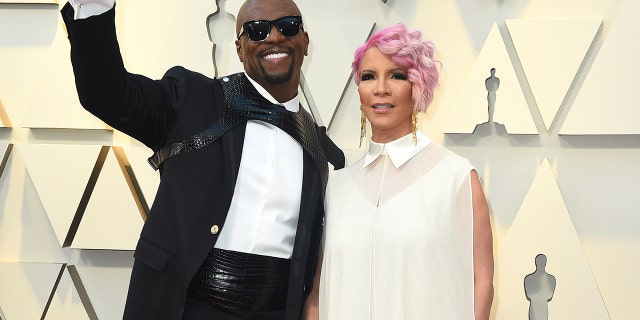 Terry Crews, left, and Rebecca King-Crews arrive at the Oscars on Sunday, Feb. 24, 2019, at the Dolby Theatre in Los Angeles.