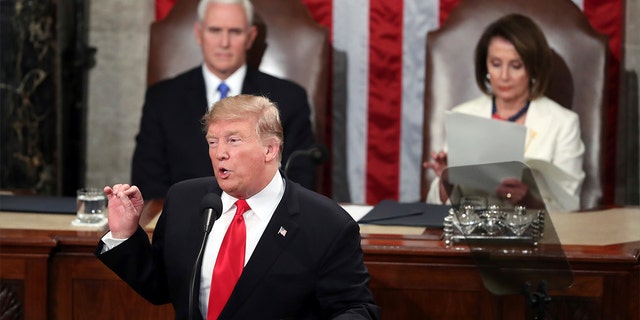 President Trump delivers his State of the Union address on Tuesday night, flanked by Vice President Mike Pence and House Speaker Nancy Pelosi. (AP Photo/Andrew Harnik)