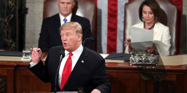 President Trump delivers his State of the Union address on Tuesday night, flanked by Vice President Mike Pence and House Speaker Nancy Pelosi. (AP Photo/Andrew Harnik)