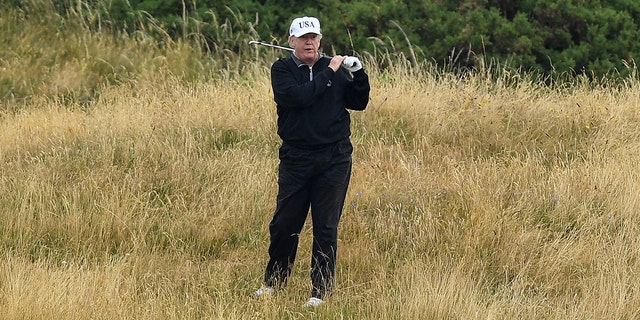 TURNBERRY, SCOTLAND - JULY 15: U.S. President Donald Trump plays a round of golf at Trump Turnberry Luxury Collection Resort during the U.S. President's first official visit to the United Kingdom on July 15, 2018 in Turnberry, Scotland. The President of the United States and First Lady, Melania Trump on their first official visit to the UK after yesterday's meetings with the Prime Minister and the Queen is in Scotland for private weekend stay at his Turnberry. (Photo by Leon Neal/Getty Images)