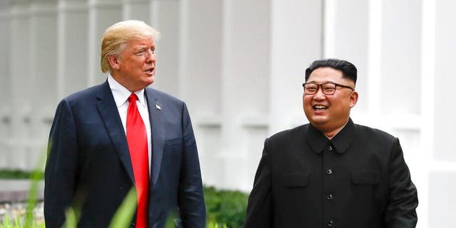 FILE - In this June 12, 2018, file photo, President Donald Trump, left, and North Korea leader Kim Jong Un walk from their lunch at the Capella resort on Sentosa Island in Singapore. (AP Photo/Evan Vucci, File)