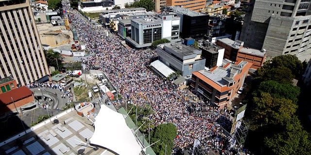 Opposition supporters take part in a rally against Venezuelan President Nicolas Maduro on Saturday, Feb. 2, 2019.