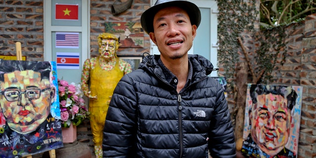 Artist Tran Lam Binh is seen with some of his creations in Hanoi, Vietnam, Feb. 25, 2019. (Associated Press)