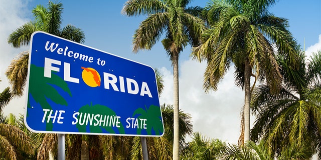 Low angle tropical landscape with a welcome sign to hot weather