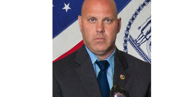 In this undated photo provided by the New York City Police Department, Det. Brian Simonsen is shown. New York Police Commissioner James O'Neill told the media during a news conference that Simonsen was shot and killed by friendly fire Tuesday night, Feb. 12, 2019, while responding to a report of an armed robbery at a T-Mobile store in the Richmond Hill section of Queens. (New York City Police Department via AP)