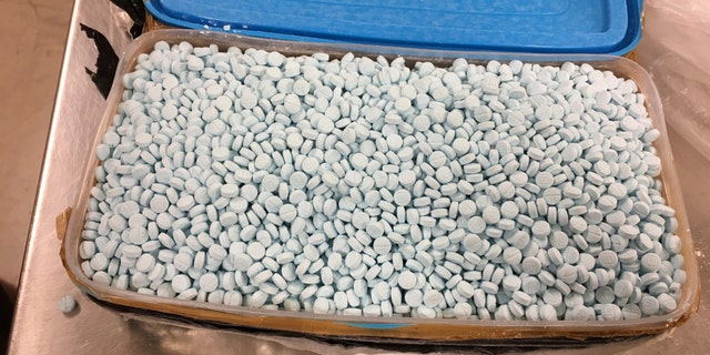 This photo provided by the U.S. Drug Enforcement Administration's Phoenix Division shows some of the 30,000 fentanyl pills the agency seized in one of its bigger busts, in Tempe, Ariz., in August, 2017.