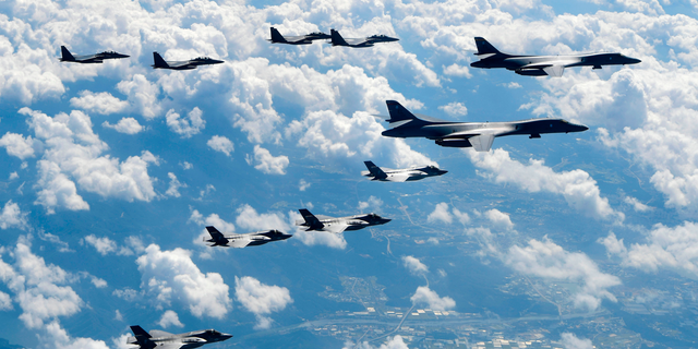 FILE - In this Sept. 18, 2017, file photo provided by South Korea Defense Ministry, U.S. Air Force B-1B bombers, F-35B stealth fighter jets and South Korean F-15K fighter jets fly over the Korean Peninsula during joint drills. Ahead of the second summit between U.S. President Donald Trump and North Korean leader Kim Jong Un, some observers say there is an uncertainty over the future of the decades-long military alliance between Washington and Seoul. (South Korea Defense Ministry via AP, File)