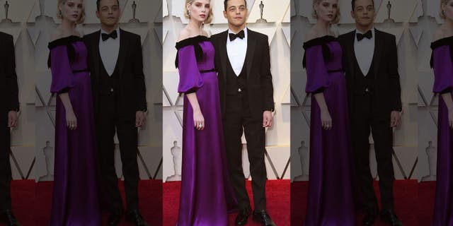Lucy Boynton, left, and Rami Malek arrive at the Oscars on Sunday, Feb. 24, 2019, at the Dolby Theatre in Los Angeles.