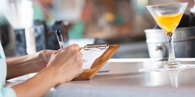 Hehsus Baeza, a staffer at Tkilaz Mexican Restaurant Bar and Grill in Midland, said he was disgusted to find the message on a $17.55 bill from a patron.