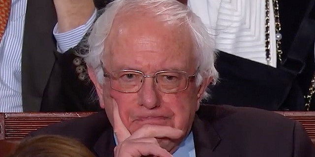 Sanders scowled as President Trump vowed that 'America will never be socialist.'