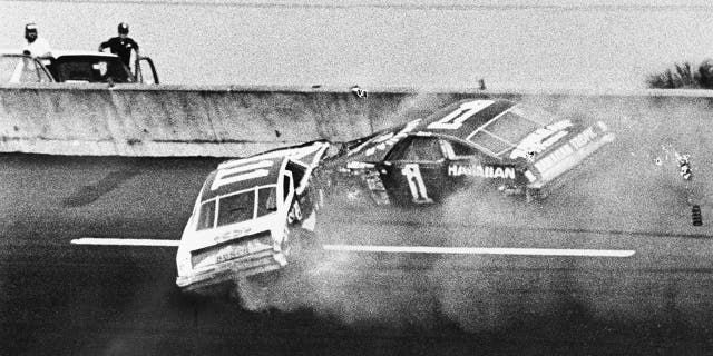 Donnie Allison, in car 1, and Cale Yarborough, in car 11, crashed on the last lap of the Daytona 500 to put Richard Petty in Victory Lane.