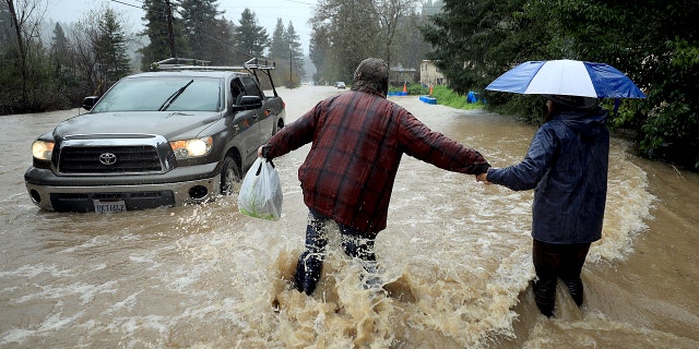 Residents of Armstrong Woods Road return home after the road became impassable for most vehicles on Tuesday, February 26, 2019 in Guerneville, California.