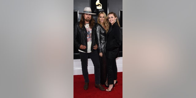 Billy Ray Cyrus, left, Tish Cyrus and Miley Cyrus arrive at the 61st Annual Grammy Awards at the Staples Center on Sunday, February 10, 2019 in Los Angeles.