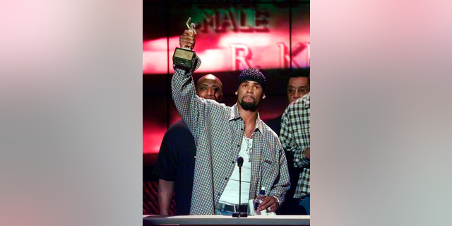 FILE - In this March 26, 1999 file photo, R. Kelly accepts the Sammy Davis Jr. Award for Male "Entertainer of the Year" at the 13th annual Soul Train Music Awards in Los Angeles. (AP Photo/Mark J. Terrill, File)