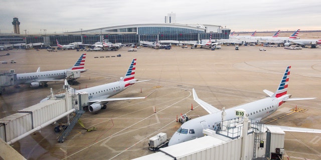 Flights in the Dallas area were delayed Wednesday afternoon when air traffic controllers were forced to evacuate the Terminal Radar Approach Control (TRACON) after a report of smoke in the building.