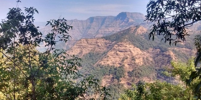 Layered lava flows within the Wai Subgroup from near Ambenali Ghat, Western Ghats. (Credit: Courtney Sprain)