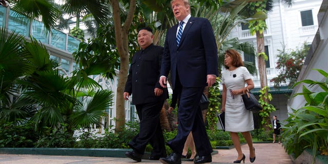 President Donald Trump and North Korean leader Kim Jong Un take a walk after their first meeting at the Sofitel Legend Metropole Hanoi hotel.