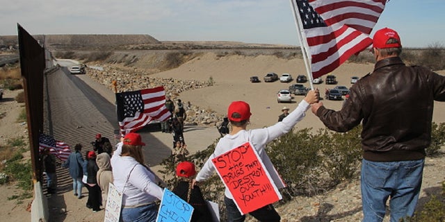 Supporters of the U.S. Republican Party make a human wall to demonstrate in favor of the construction of the border wall between the United States and Mexico, at the border between Sunland Park, New Mexico, United States and Ciudad Juarez, Chihuahua state, Mexico, on February 9, 2019. [Photo by Herika Martinez / AFP) (Photo credit should read HERIKA MARTINEZ/AFP/Getty Images)