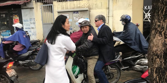 Sean Hannity riding a scooter in Vietnam.