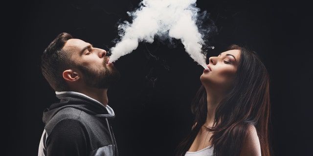 Vaping seems to be the new wedding photo trend for young couples.