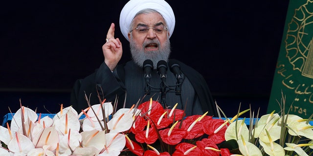 Iranian President Hassan Rouhani speaks during a ceremony celebrating the 40th anniversary of the Islamic Revolution.