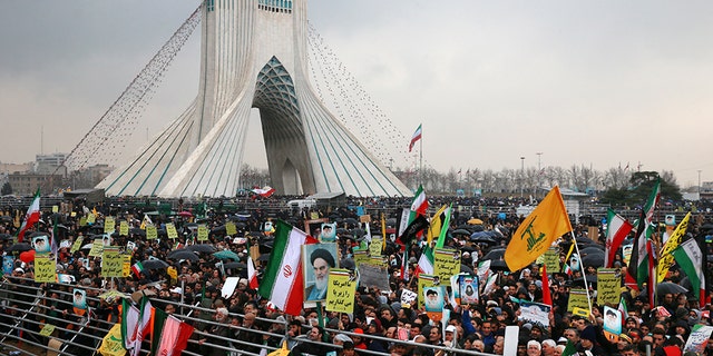 Iranians attend a ceremony celebrating the 40th anniversary of the Islamic Revolution, at the Azadi, or Freedom Tower, in Tehran, Iran, Monday, Feb. 11.