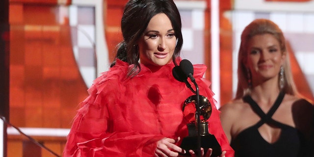 Kacey Musgraves accepts the award for best country album for "Golden Hour" at the 61st annual Grammy Awards on Sunday, Feb. 10, 2019, in Los Angeles.