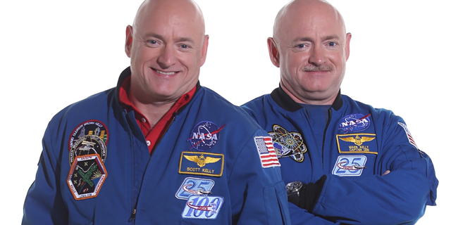 File photo - Scott Kelly (left) spent a year in space while his identical twin Mark (right) stayed on Earth as a control subject.