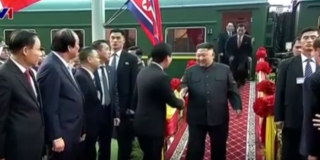 Kim Jong Un's interpreter sprints after the leader on Tuesday.