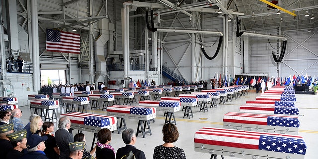 Caskets containing the remains of American servicemen from the Korean War handed over by North Korea arrive at Joint Base Pearl Harbor-Hickam in Honolulu, Hawaii, U.S., August 1, 2018. REUTERS/Hugh Gentry - RC1490AADB00