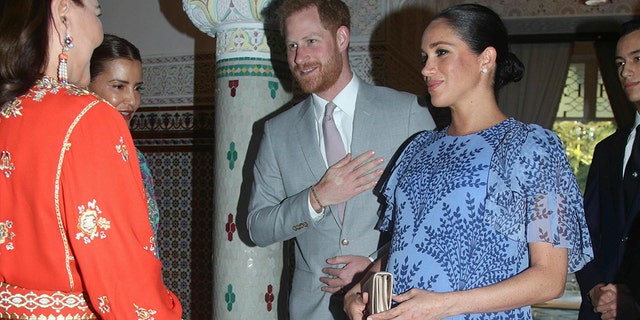 British Prince Harry and Meghan, the Duchess of Sussex, are greeted by Princess Lalla Meryem of Morocco on the left and Princess Lalla Hasna of Morocco at the residence of King Mohammed VI of Morocco on the third day of their tour of Morocco , in Rabat, Monday, February 25, 2019.