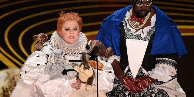 Melissa McCarthy, left, and Brian Tyree Henry present the award for best costume design at the Oscars on Sunday, Feb. 24, 2019, at the Dolby Theatre in Los Angeles. (Photo by Chris Pizzello/Invision/AP)