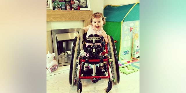 Harmonie-Rose will mostly be pushed around the course in her wheelchair, but her family hope she will be able to run the last few meters on her prosthetic legs.