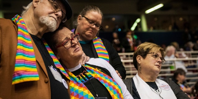 Ed Rowe, left, Rebecca Wilson, Robin Hager and Jill Zundel, react to the defeat of a proposal that would allow LGBT clergy and same-sex marriage within the United Methodist Church at the denomination's 2019 Special Session of the General Conference in St. Louis.