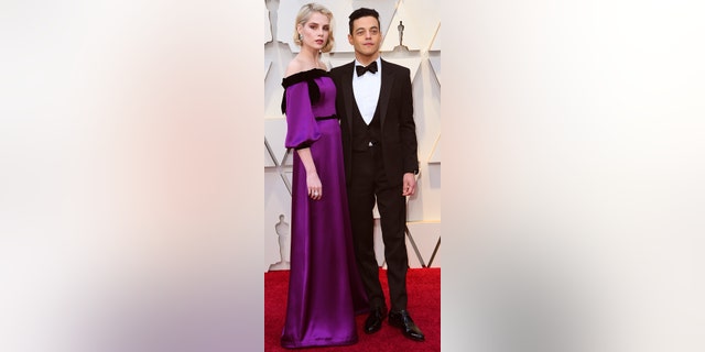 Lucy Boynton, left, and Rami Malek arrive at the Oscars on Sunday, Feb. 24, 2019, at the Dolby Theatre in Los Angeles. (Photo by Richard Shotwell/Invision/AP)