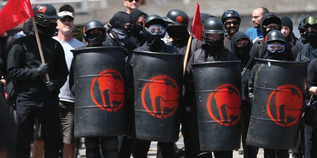 Antifa protesters at a rally. [Mark Graves/The Oregonian/via AP)