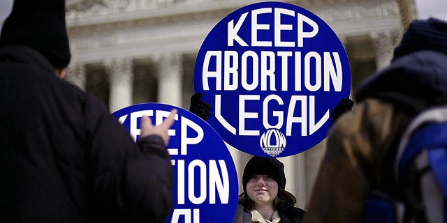 Abortion supporters at the Supreme Court as several states push abortion bills. (TIM SLOAN/AFP/Getty Images)