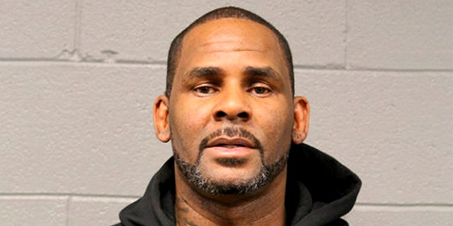In this photo taken and released by the Chicago Police Dept., Friday, Feb. 22, 2019, R&B singer R. Kelly is photographed during booking at a police station in Chicago, Il. (Chicago Police Dept. via AP)