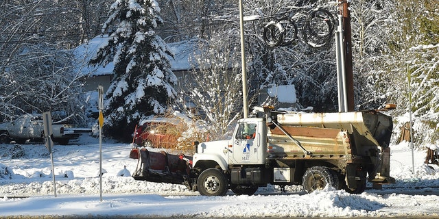  A sanding truck from the city of Olympia goes to a street on Sunday, February 10, 2019 in Olympia, Washington. 