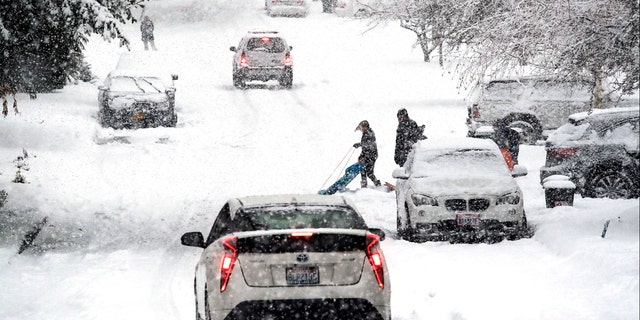 Snowball fight leads to driver's arrest after nearly running down group ...