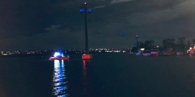 In this photo provided by Kasia Gregorczyk, more than a dozen people are trapped on a ride at SeaWorld Monday, Feb. 18, 2019, in San Diego.