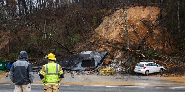 Rescue workers investigated the damage caused by a night mud that destroyed a subway restaurant on Signal Mountain Road in Chattanooga, Tennessee, on Saturday, February 23, 2019.