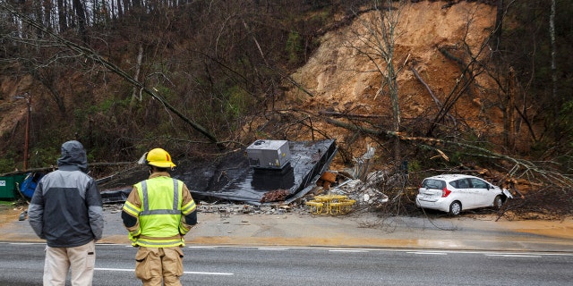 Emergency workers survey damage after an overnight mudslide destroyed a Subway restaurant on Signal Mountain Road in Chattanooga, Tenn., Saturday, Feb. 23, 2019.