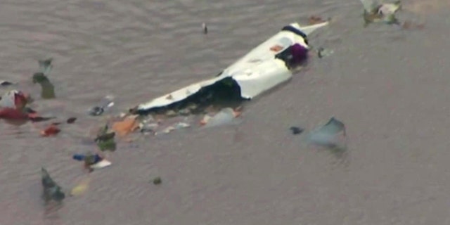 This image taken from video provided by KRIV FOX 26 shows the scene of a cargo plane crash on Saturday, Feb. 23, 2019 in Trinity Bay, just north of Galveston Bay and the Gulf of Mexico in Texas.